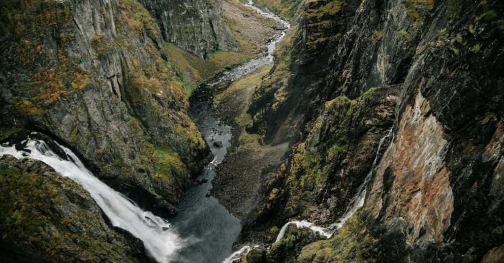 from-above-of-powerful-waterfall-falling-from-rocky-cliff-in-mountainous-ravine-in-highland-2